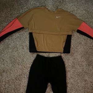 A brown, black and pink Nike outfit